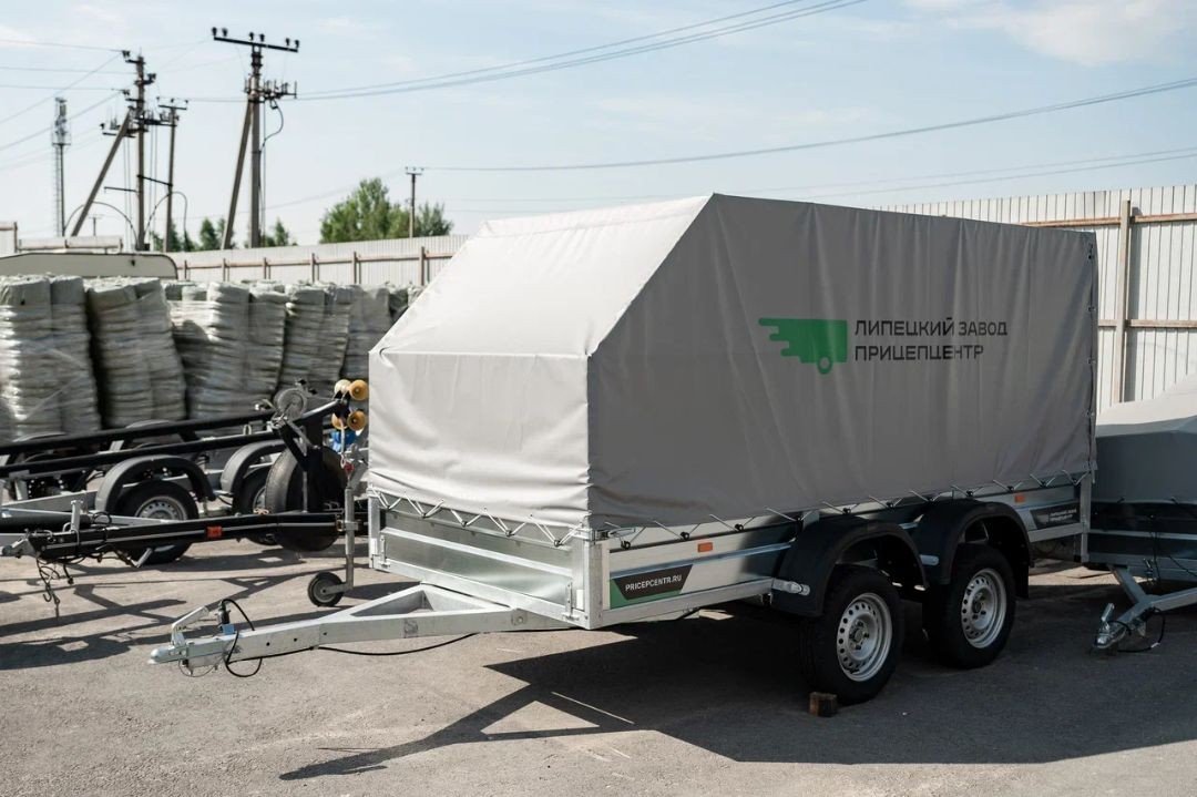 

Двухосный прицеп Титан 3518-03 2ос (3.5х1.8 борт 30см, тент 1200 Аэро)